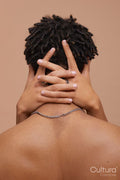 Studio rear shot of man embraced by partner
