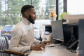 Male receptionist working in office