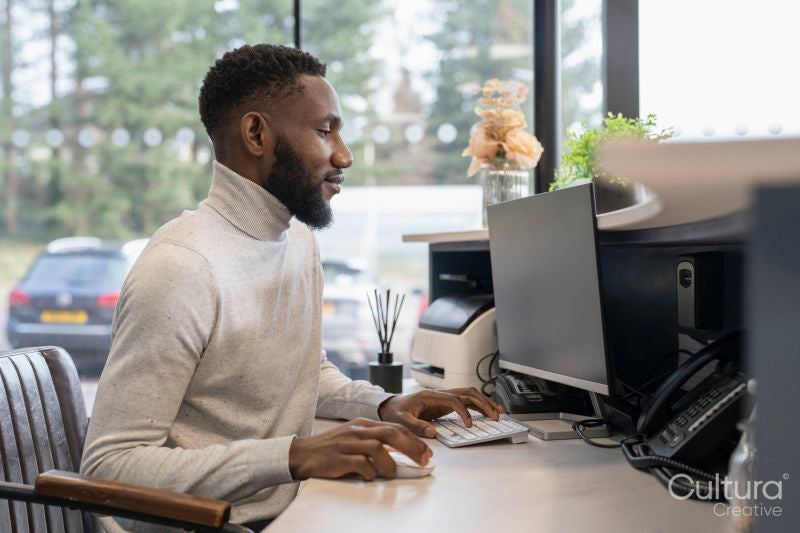 Male receptionist working in office