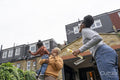 Mother and daughters playing with soap bubbles