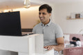 Man working on laptop at home