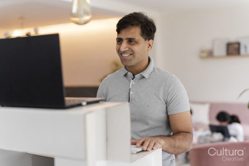 Man working on laptop at home