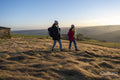 Female hikers walking in rural landscape