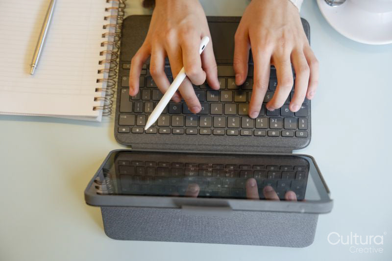 Close-up of female hands using tablet and stylus pen