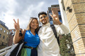 United Kingdom, London, Portrait of tourist couple gesturing