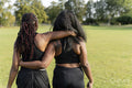 Young female friends walking in park after exercising