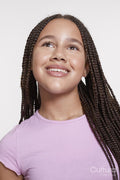 Studio portrait of smiling girl with braided hair