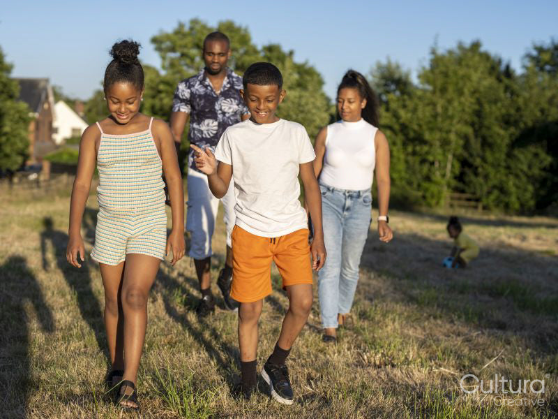 Family with children walking in countryside