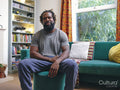 Portrait of man sitting on sofa