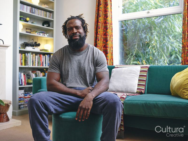 Portrait of man sitting on sofa