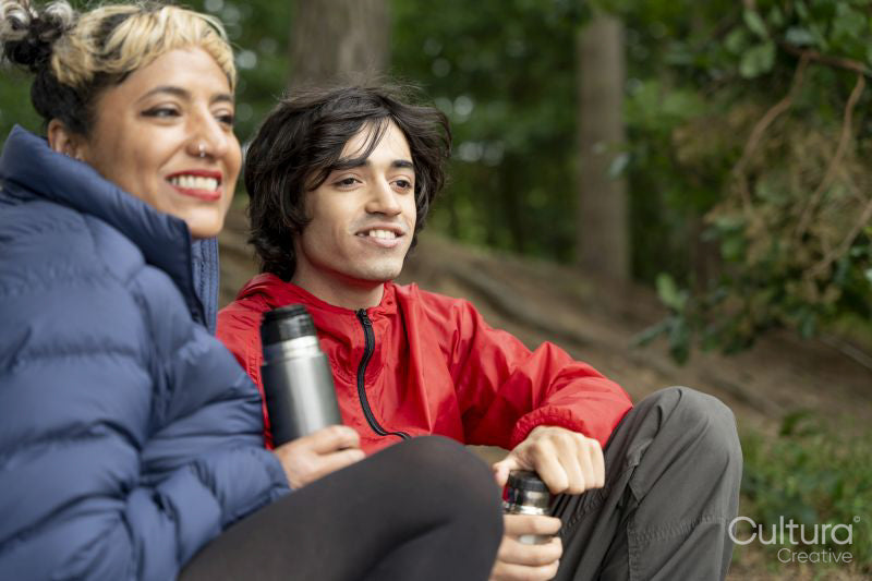Mother and son relaxing in forest
