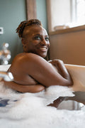 Senior woman taking bubble bath