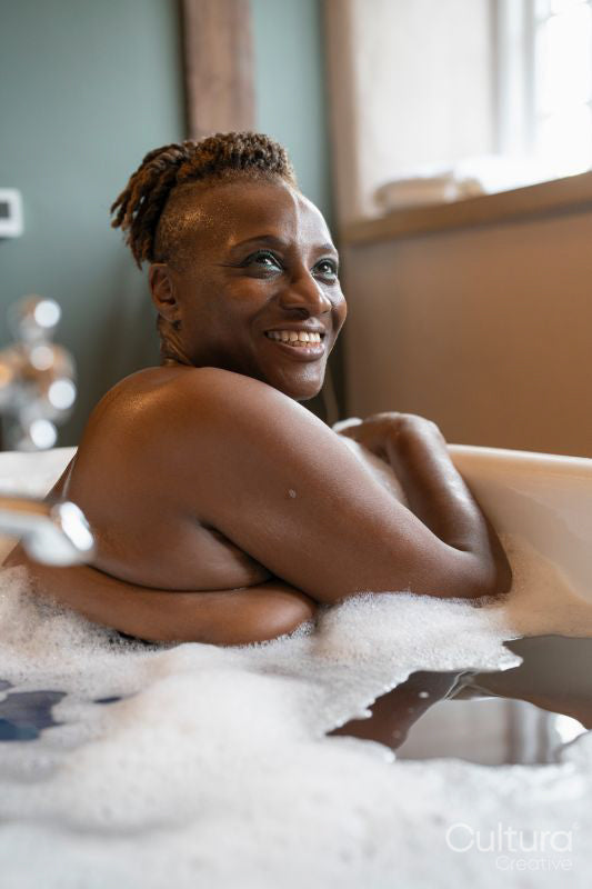 Senior woman taking bubble bath