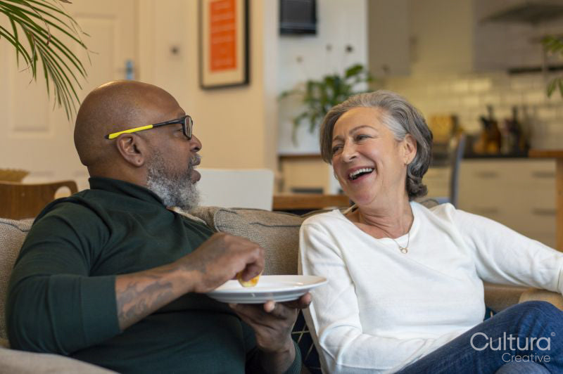 Senior couple sitting on sofa