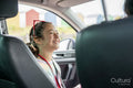 Smiling girl sitting in car