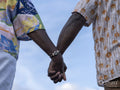 Close-up of couple holding hands