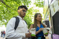 Tourist couple buying street food