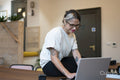 Woman using laptop in office
