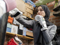 Woman punching boxing bag