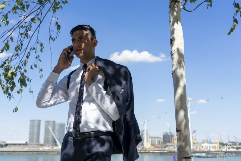 Businessman talking on phone outdoors