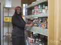 Portrait of female volunteer working in community food center