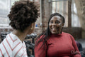 Mother with daughter talking in gym before training