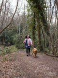 Girl with dog in forest