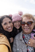 Grandmother, mother and daughter taking selfie