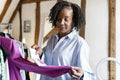 Fashion designer comparing color swatches with clothing