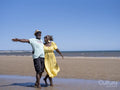 Mature couple walking on beach