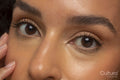 Close-up of woman with brown eyes