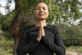 Woman meditating in park