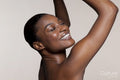 Smiling young woman dancing