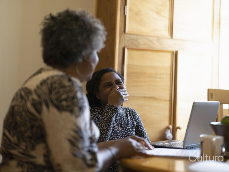 Mother helping daughter with homework