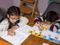 Siblings doing homework