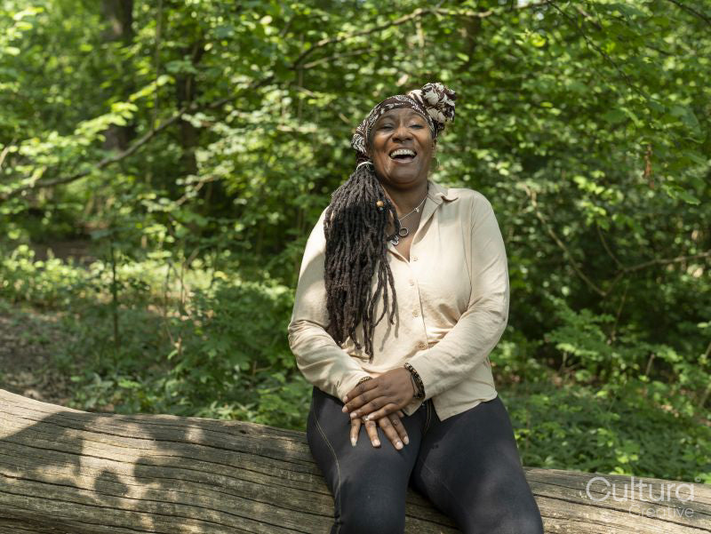 Portrait of smiling mature woman on hike in forest