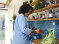 Woman unpacking grocery bags in kitchen