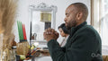 Mature couple praying before Kwanzaa meal