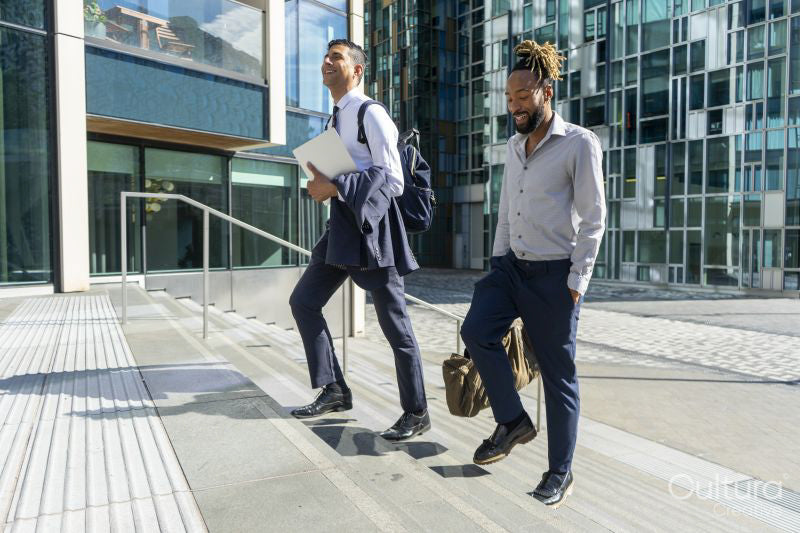 Two businessmen walking in business district