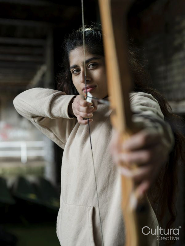 Young woman at archery training