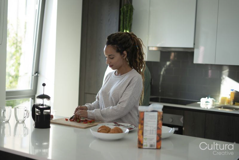 Woman preparing meal in kitchen