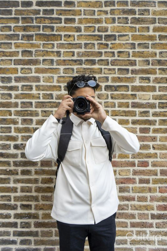 Young man using camera