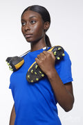 Studio portrait of woman with soccer shoes