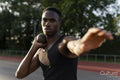 Portrait of shot putter preparing to throw