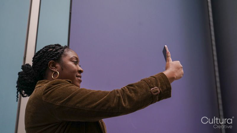 Woman using phone to take selfie