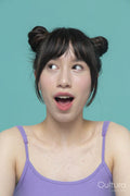 Studio portrait of surprised girl
