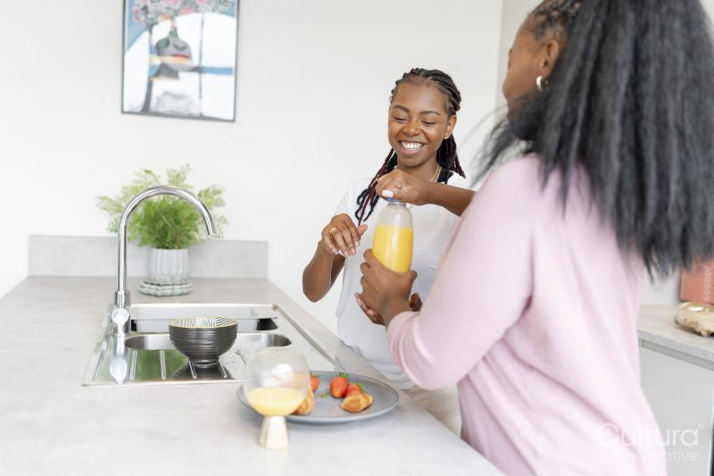 couple preparing breakfast in kitchen