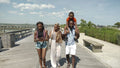 Smiling family walking on pier