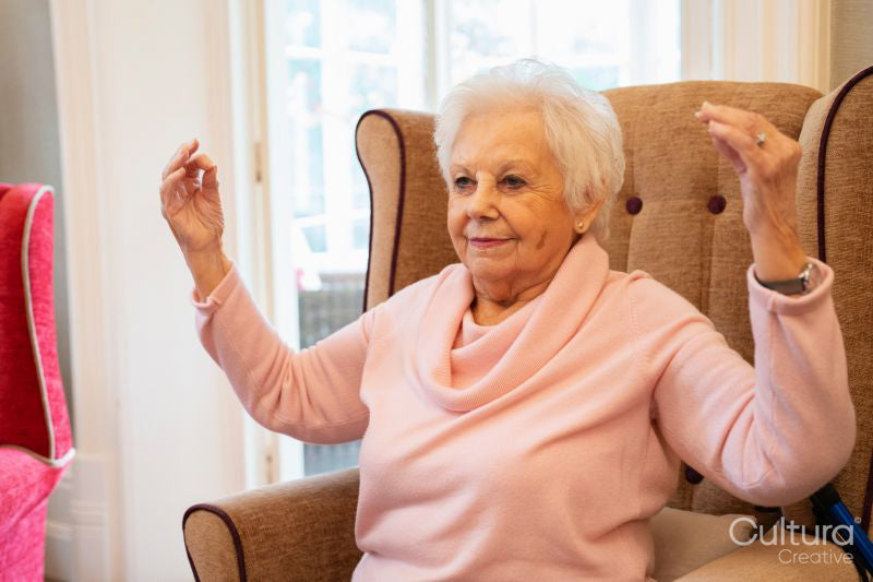 Senior woman doing relaxation exercise at nursing home