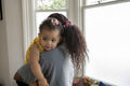 Mother with baby daughter at home